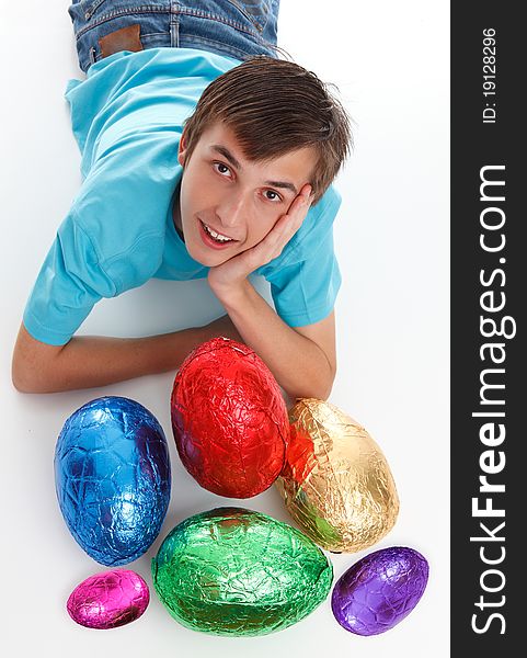 Boy with a bunch of chocolate easter eggs