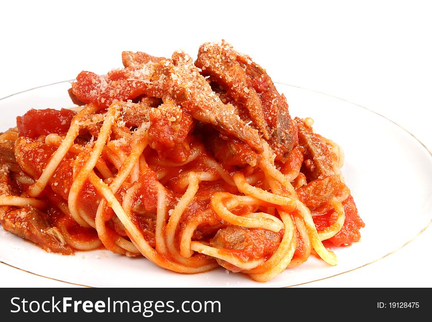Spaghetti on a plate with cheese parmesan, sauce and meat