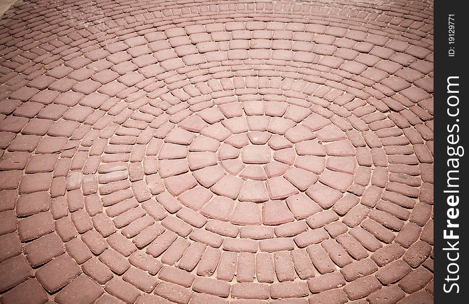 An old pattern of bricks in a walkway. An old pattern of bricks in a walkway.