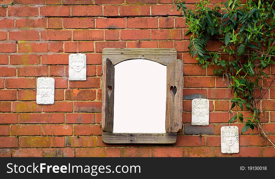 A hanging window on an old garden wall with space for your own image. A hanging window on an old garden wall with space for your own image