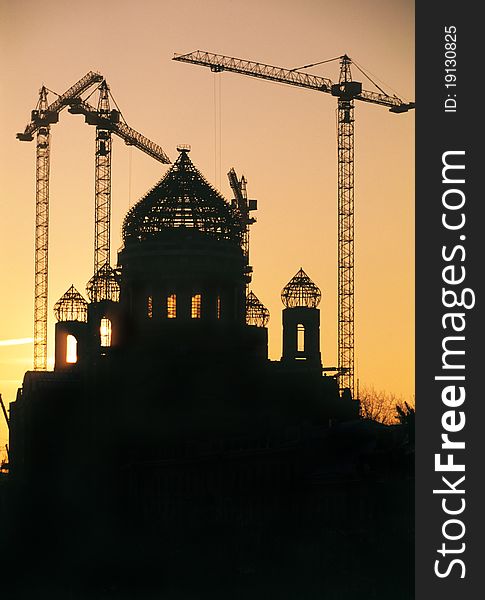 Building Cranes And Christian Cathedral
