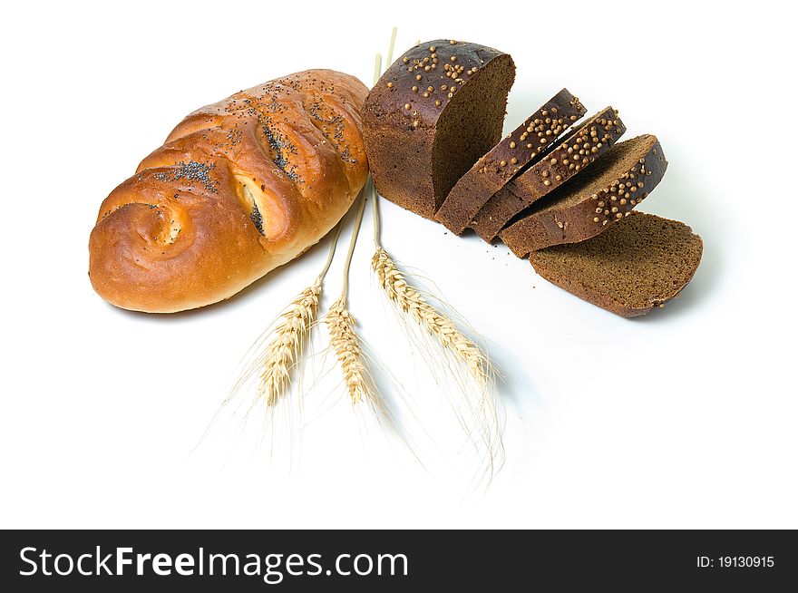 Various fresh baked goods with wheat grain and a cereal ears