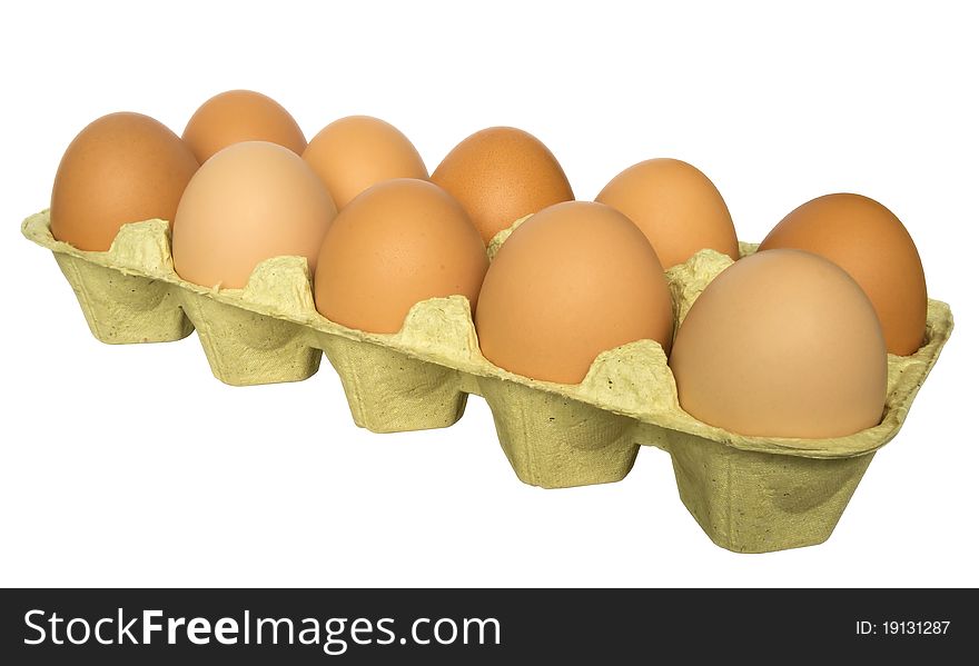 A carton of ten eggs isolated on white background. Clipping path included. A carton of ten eggs isolated on white background. Clipping path included.