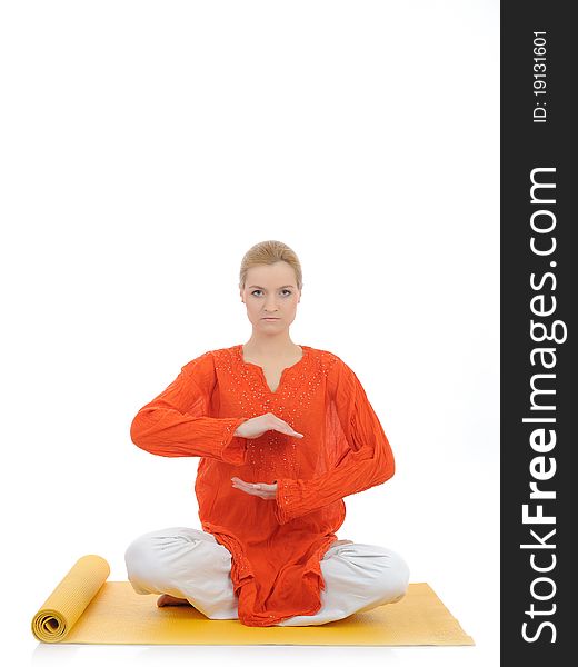 Series or yoga photos. young meditating woman on yellow pilated mat. Series or yoga photos. young meditating woman on yellow pilated mat