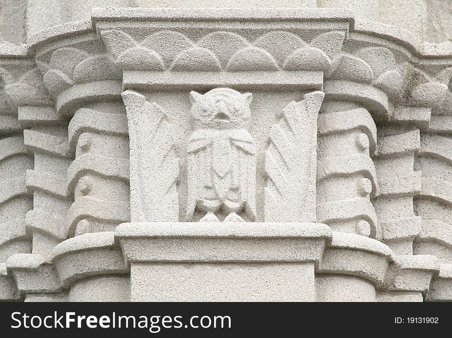 Owl cement and stone frieze
