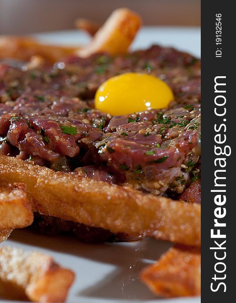 Beef tartare with and egg and french fries