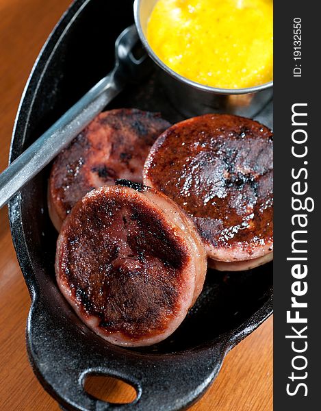 Fried bologna discs served with mustard