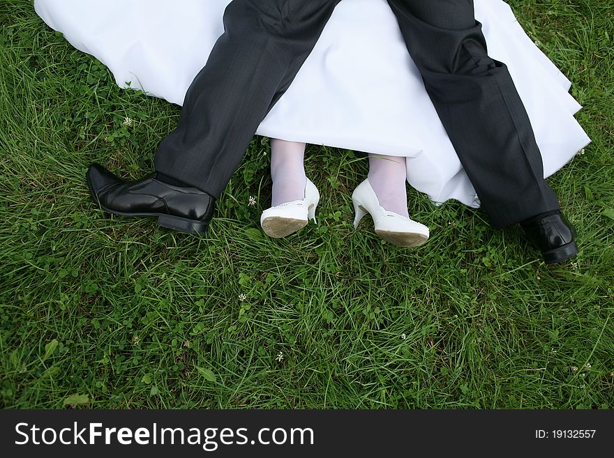 Wedding newlyweds walk ended with kisses on the grass