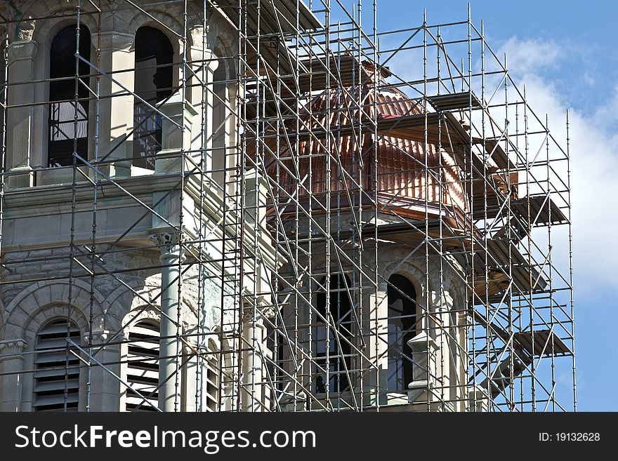 Old catholic church with scaffolding all around building as it is being renovated. Old catholic church with scaffolding all around building as it is being renovated