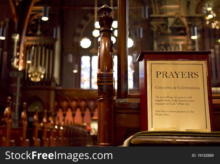 Interior view of a church with the focus on the drop box of prayers. Interior view of a church with the focus on the drop box of prayers.