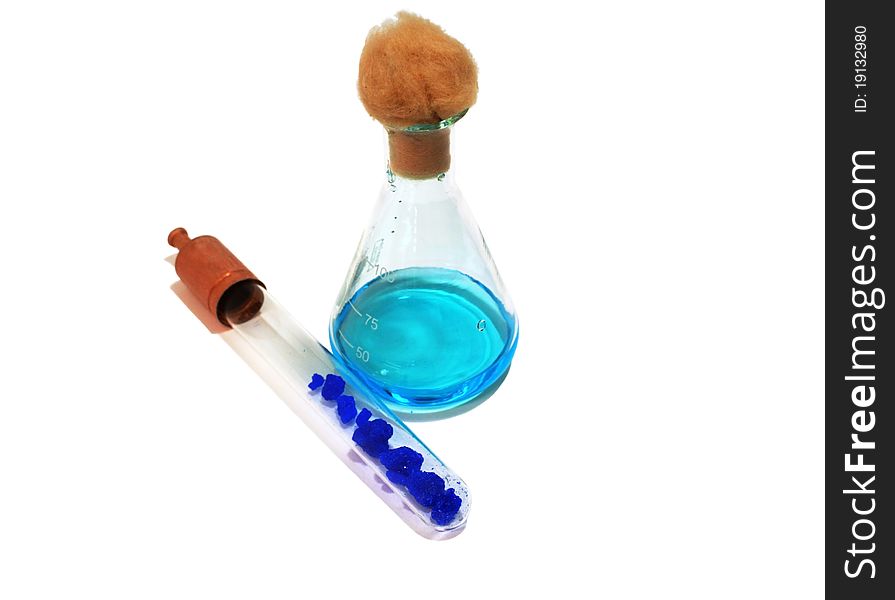 Flask with copper solution and tube with copper cristals isolated. Flask with copper solution and tube with copper cristals isolated