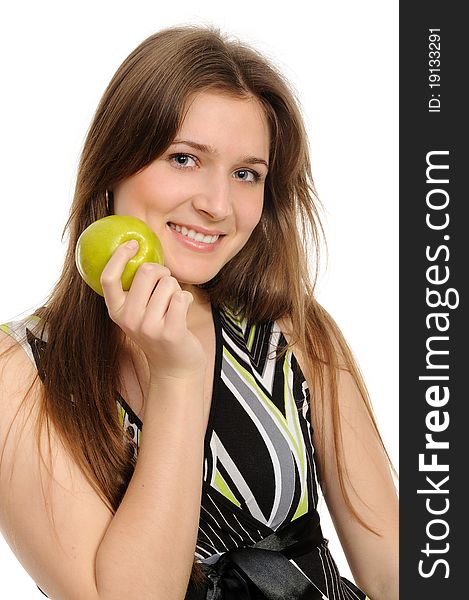 Portrait of cheerful young woman holding a  green apple and smiling isolated against white background