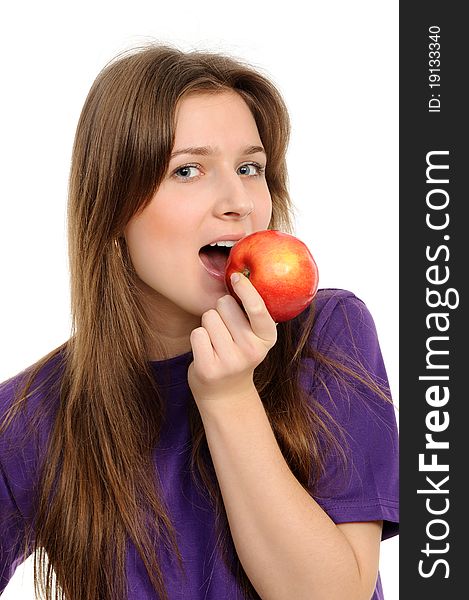 Portrait of cheerful young woman holding a red apple and smiling isolated against white background