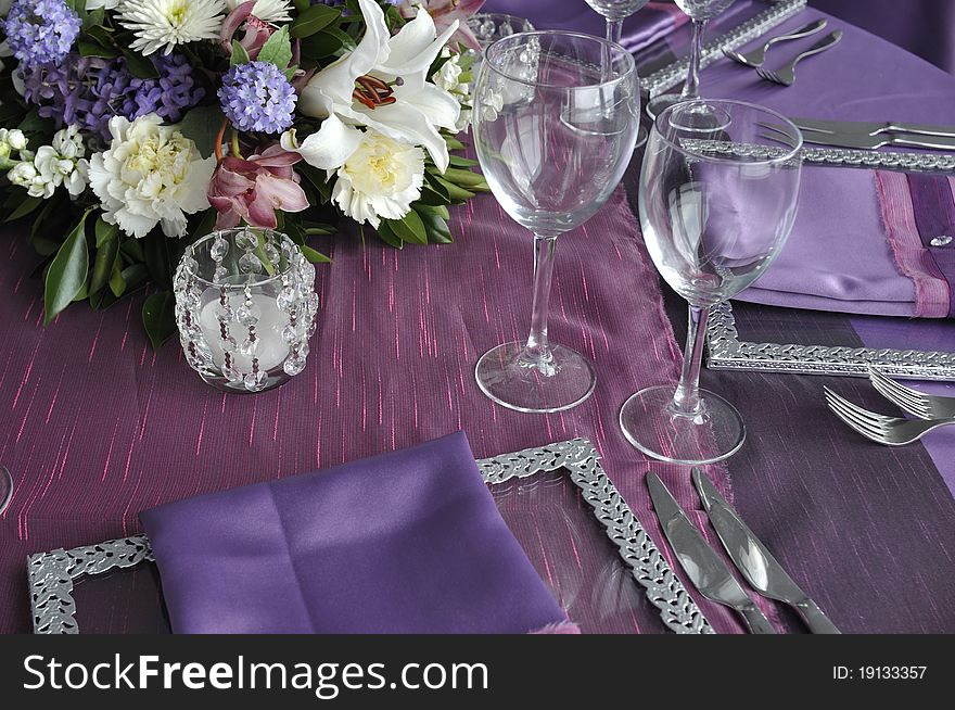 Flowers and wine glasses on the party table of wedding ceremony. Flowers and wine glasses on the party table of wedding ceremony
