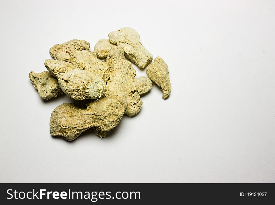 Dried ginger roots for healthy eating on white background