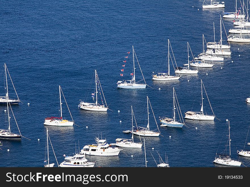 Yachts and sailboats moored in a cove