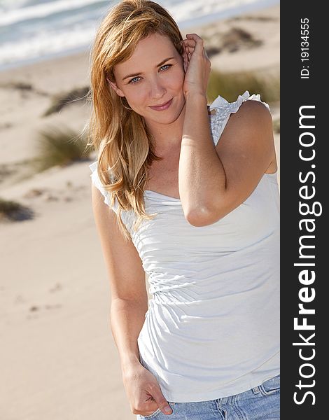 Young woman at the beach on a sunny day. Young woman at the beach on a sunny day