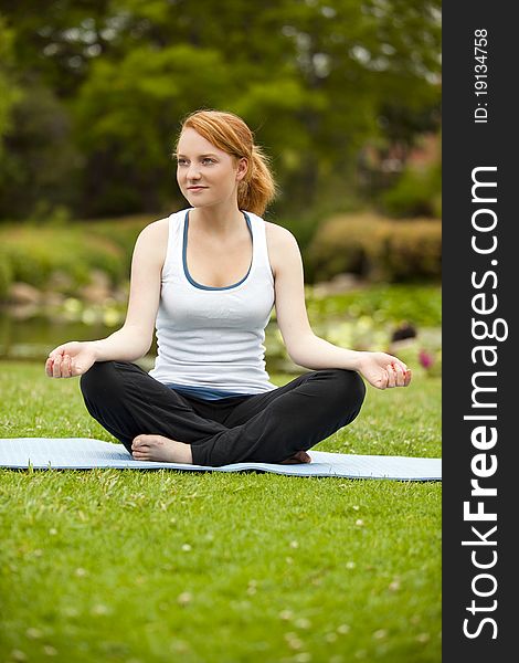 Young woman meditating yoga pose