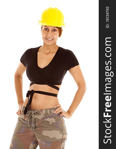 A woman is in a small shirt and a yellow hard hat. A woman is in a small shirt and a yellow hard hat.