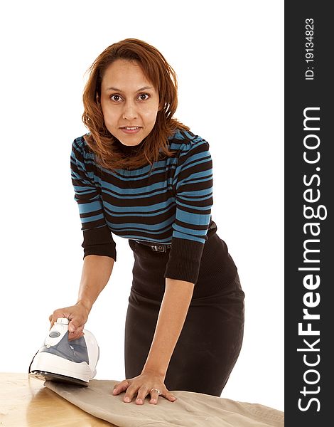 A woman is ironing and wearing a business outfit. A woman is ironing and wearing a business outfit.