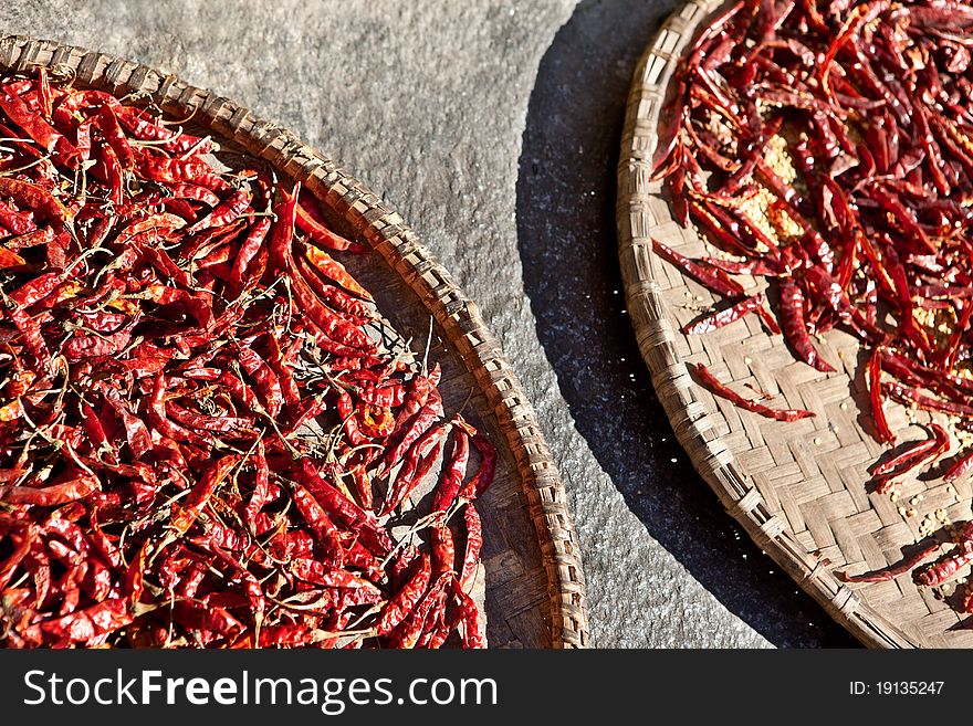 Dried chili peppers in a wicker basket