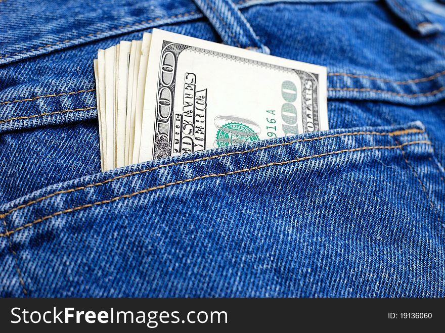 Lot of dollars in a pocket of jeans.