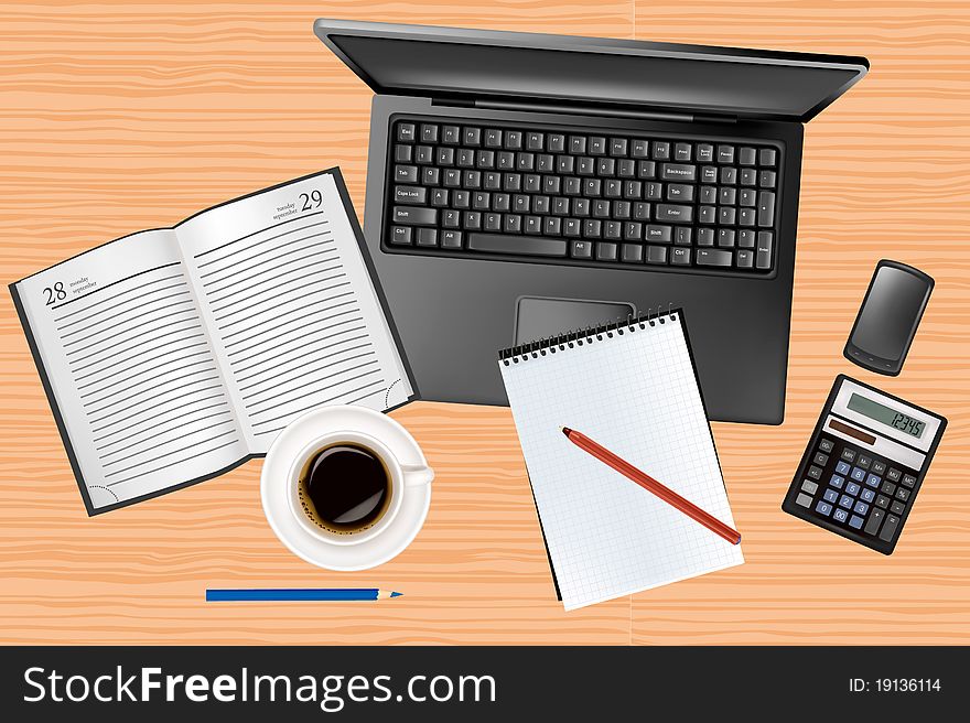 Laptop And Office Supplies Laying On The Table