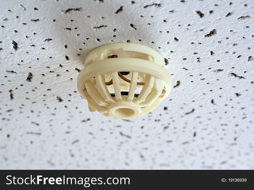 Old fire alarm sensor on the ceiling. Old fire alarm sensor on the ceiling