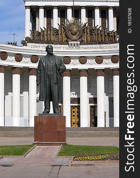 Sculpture on background of building House of Peoples of Russia, Moscow, Russia.