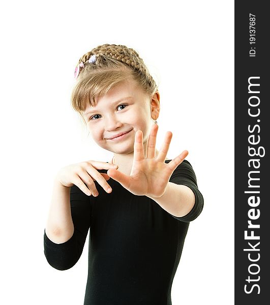 A cute girl showing her hand to the viewer isolated in a white background. A cute girl showing her hand to the viewer isolated in a white background