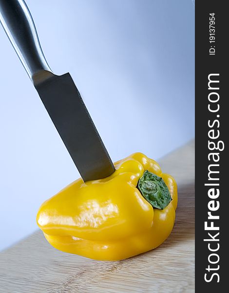 Sweet yellow pepper with a knife. Sweet yellow pepper with a knife