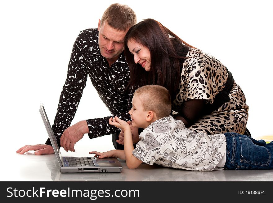 Happy family playing with laptop