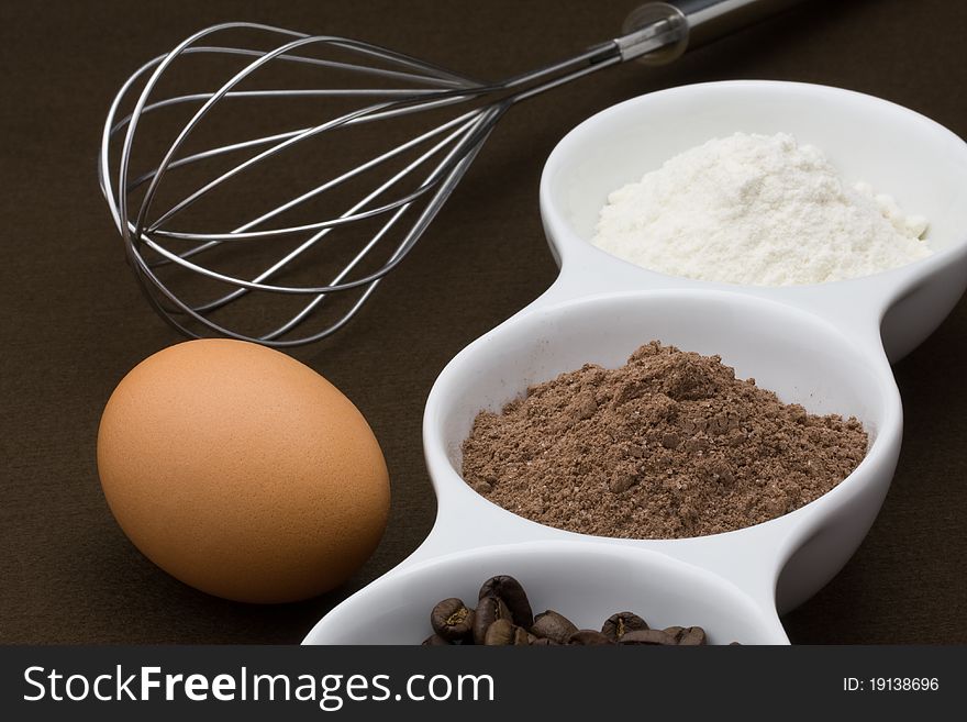 Ingredients for cake on a dark background. Ingredients for cake on a dark background