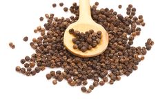 Black Peppercorns On A Wooden Spoon Royalty Free Stock Photo