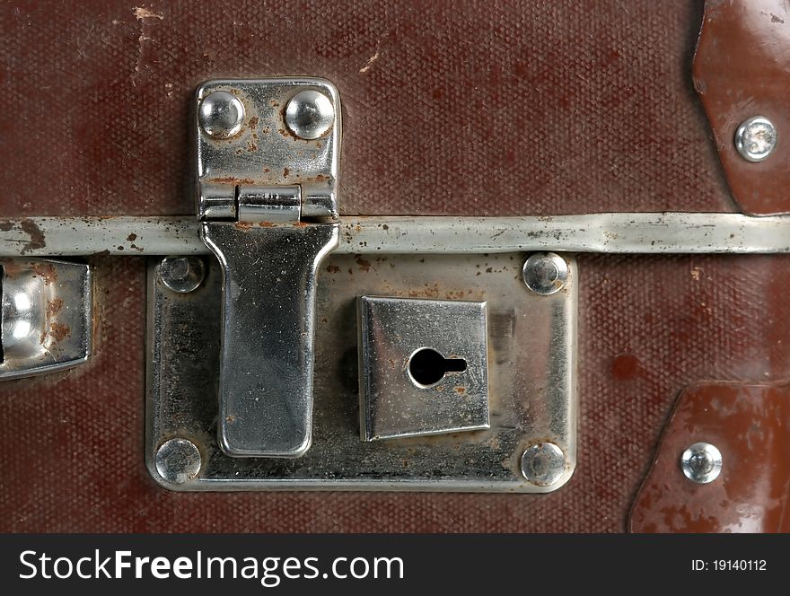 Lock of old, brown soviet suitcase. Close- up. Lock of old, brown soviet suitcase. Close- up.