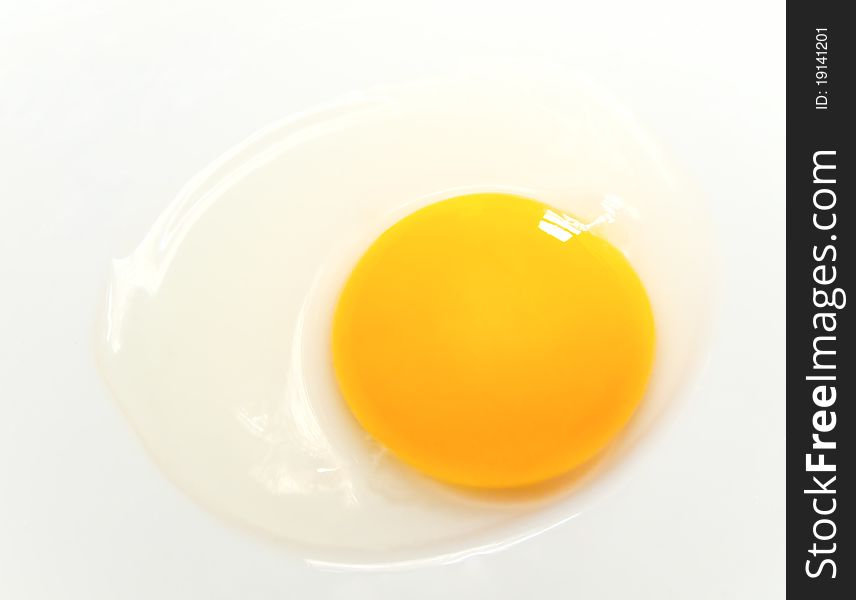 Uncooked chicken egg on white background