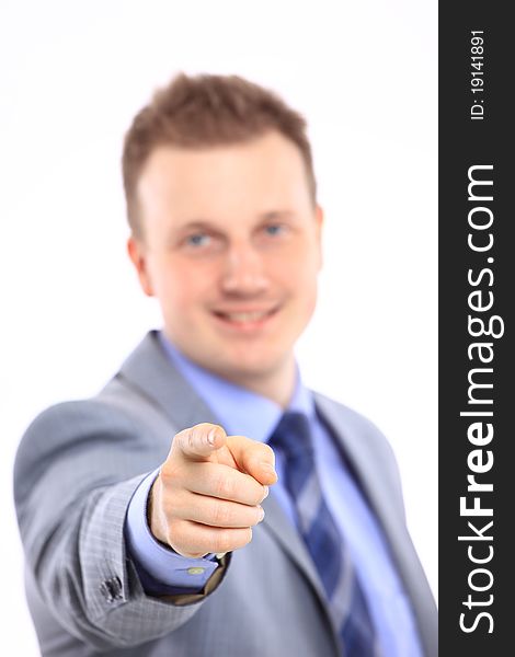 Full length of a handsome business man with hands folded against white background