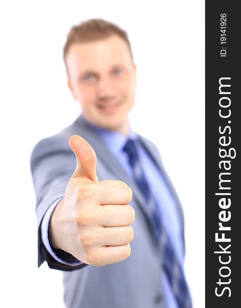 Full length of a handsome business man with hands folded against white background