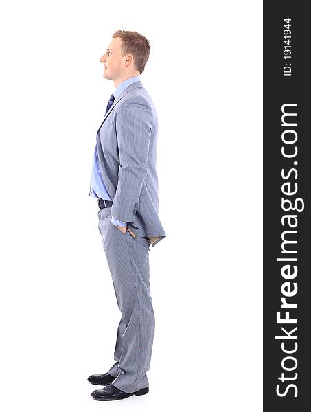 Full length of a handsome business man with hands folded against white background