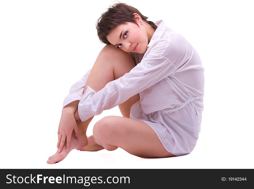 Young sexy brunette woman posing in white shirt