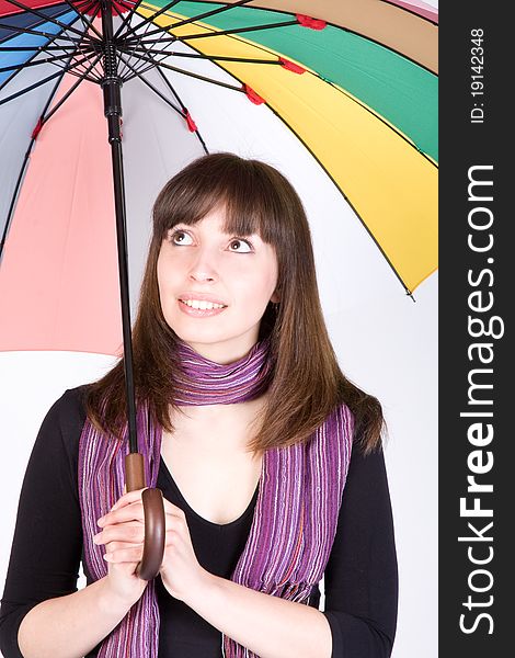 Smiling woman with colorful umbrella at studio. Smiling woman with colorful umbrella at studio