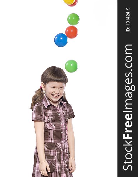 Young girl with colored balls. Young girl with colored balls