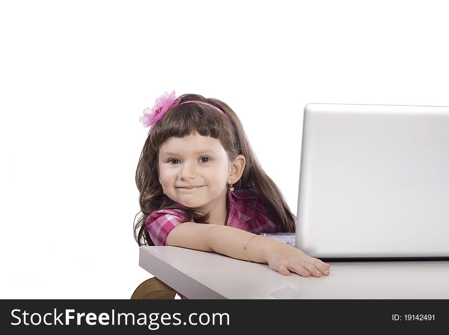 Little girl sitting at the computer. Little girl sitting at the computer