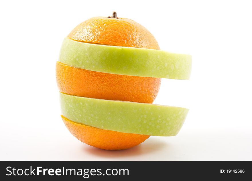 Apple and orange slices in one fruit. Apple and orange slices in one fruit