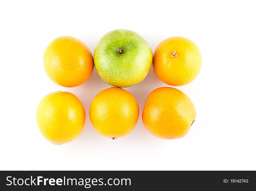Five oranges and one apple isolated