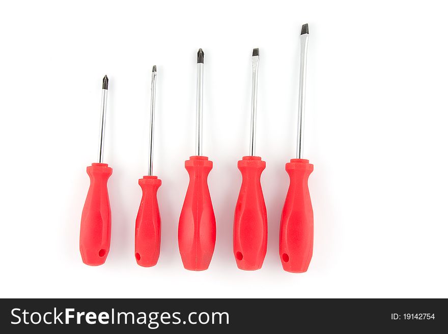 Red set of screwdrivers isolated on white