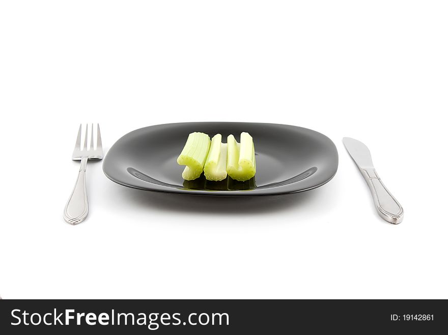 Green celery on plate ready to eat. Green celery on plate ready to eat