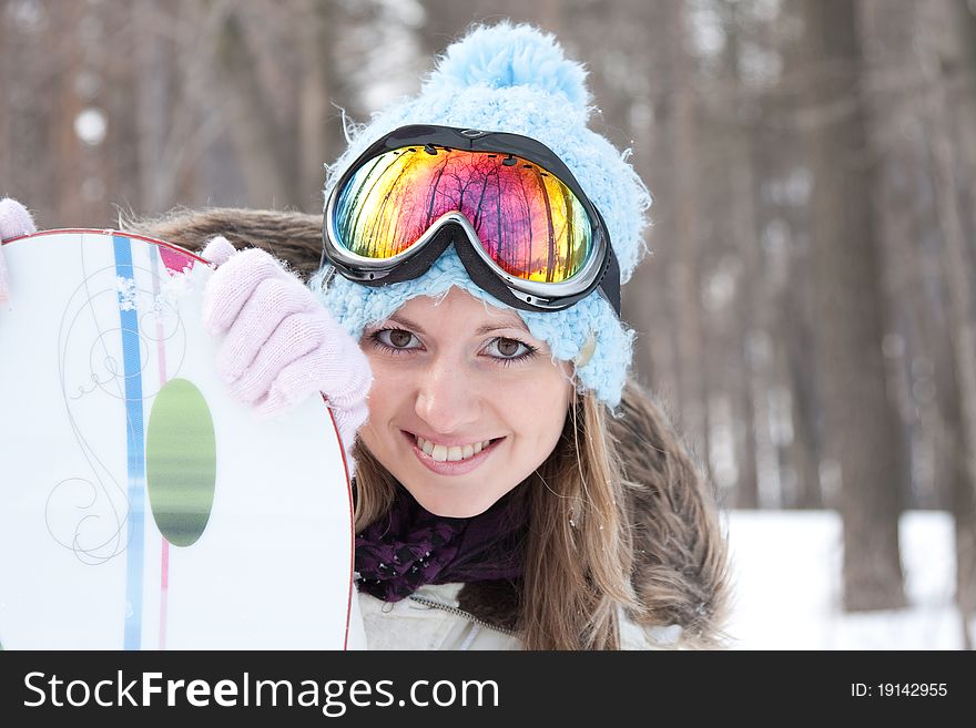 Young smiling woman in ski goggles. Young smiling woman in ski goggles