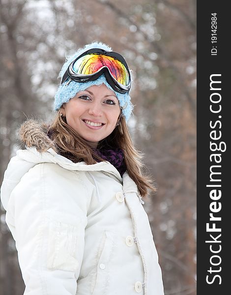 Young woman in ski goggles outdoors