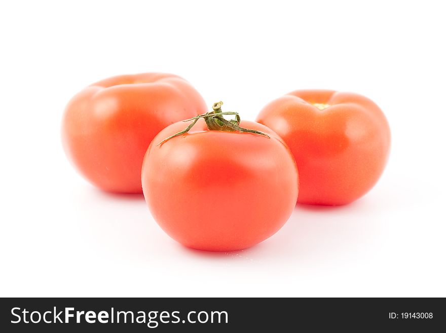 Three red tomatoes isolated on white. Three red tomatoes isolated on white